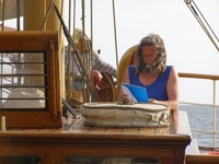 Captain Kraas reading papers.jpg